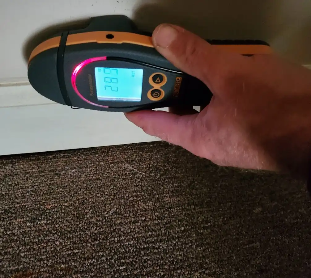 Moisture detection at baseboard during Storm Damage Restoration in Northglenn